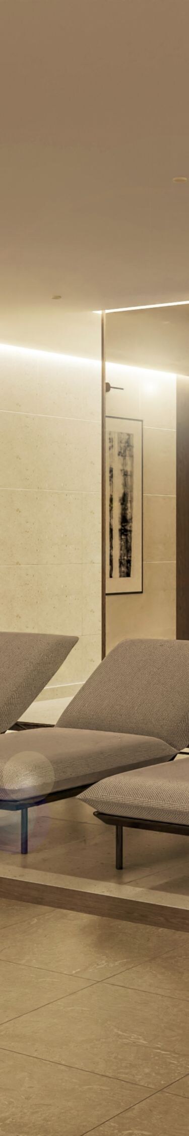 Spa relaxation room with lounge chairs and robes
