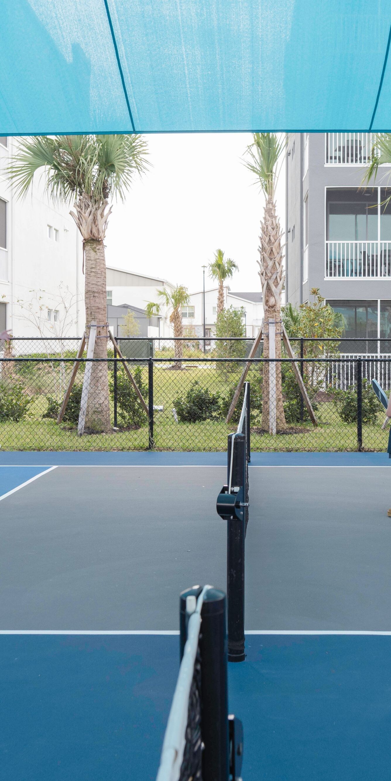 Pickleball court with players mid-play