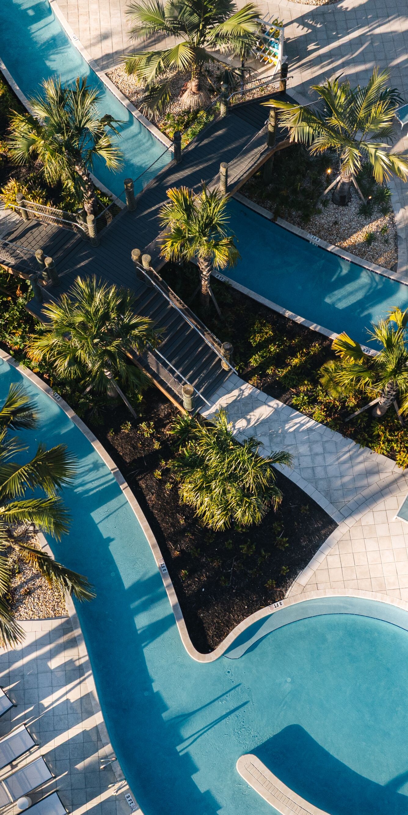 Pools shaped around greenery islands