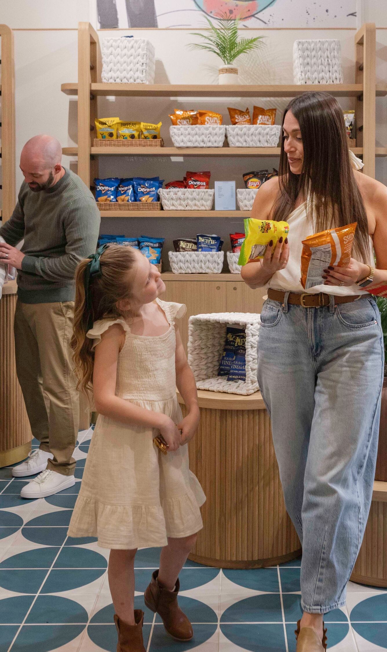Family shopping in a hotel grab-and-go market.