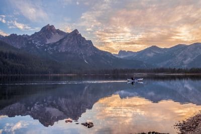 Canoe rower at Stanley Lake during sunset