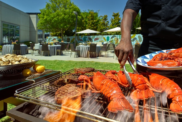 outdoor grill with lobster, steaks