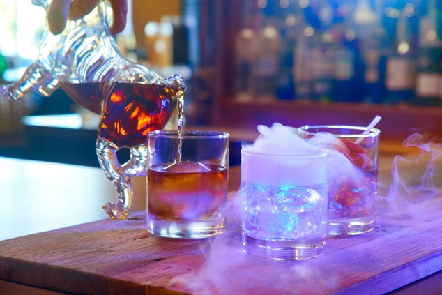 cocktails, pouring bourbon