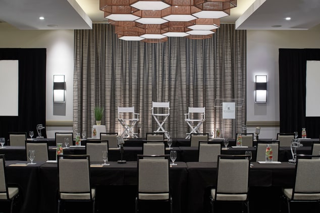 Hotel ballroom set with chairs facing stage