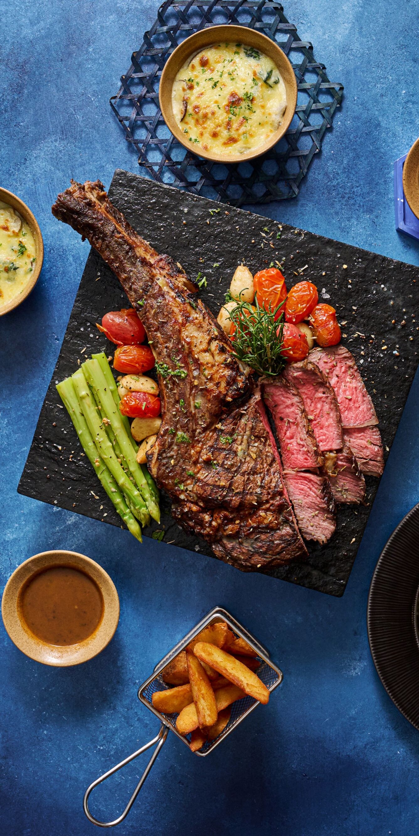 Steak entrée with sides and desserts
