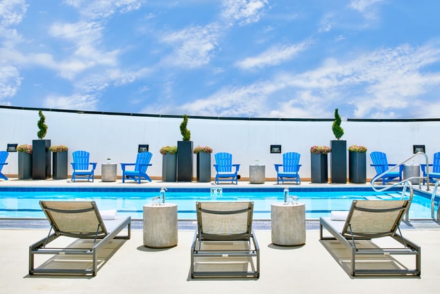 Rooftop pool with lounge chairs