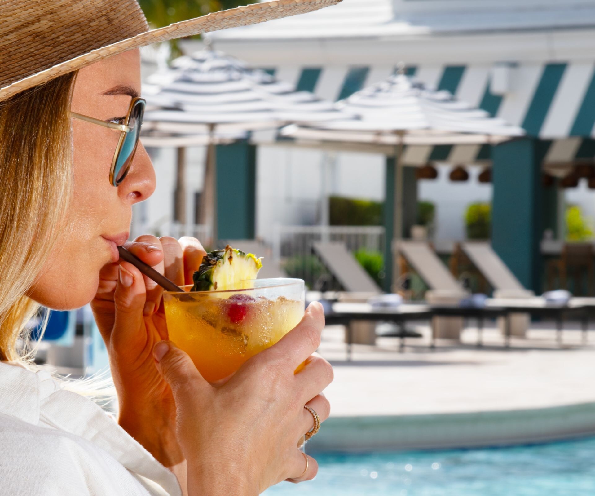Woman enjoying poolside drink