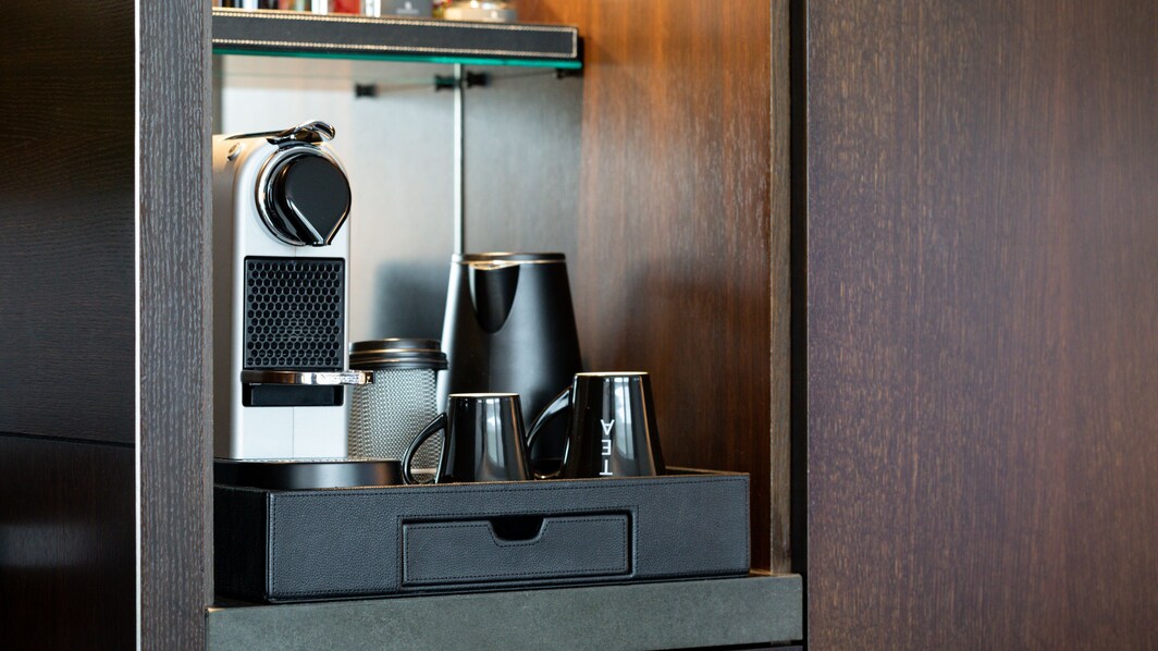Mini-bar, coffee machine, tea kettle, snack