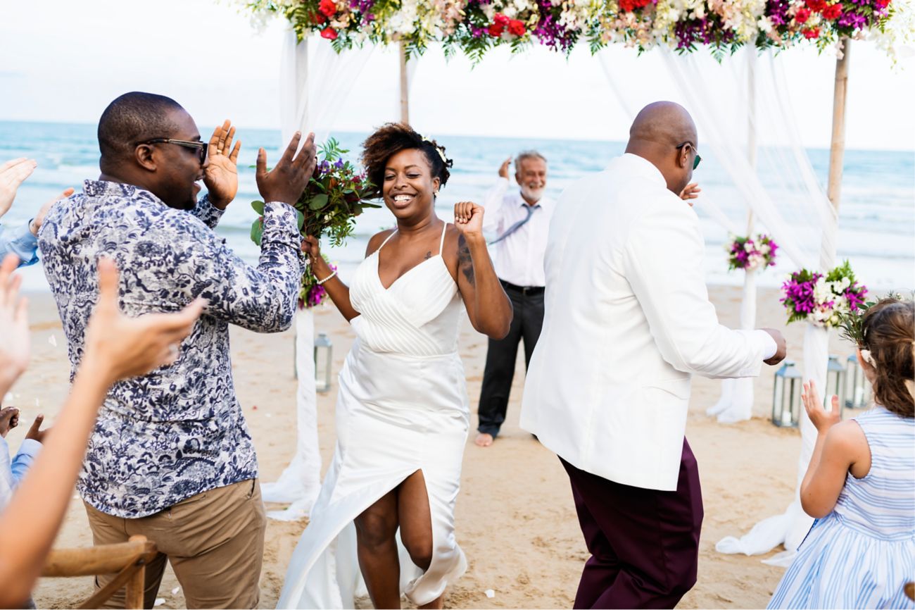 Outdoor wedding on beach, people dancing