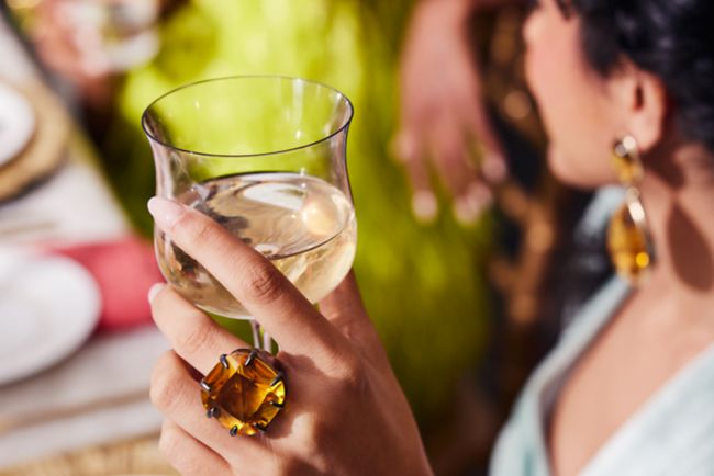  Female holding beverage at wedding dinner party