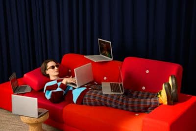 Female business traveler working on couch