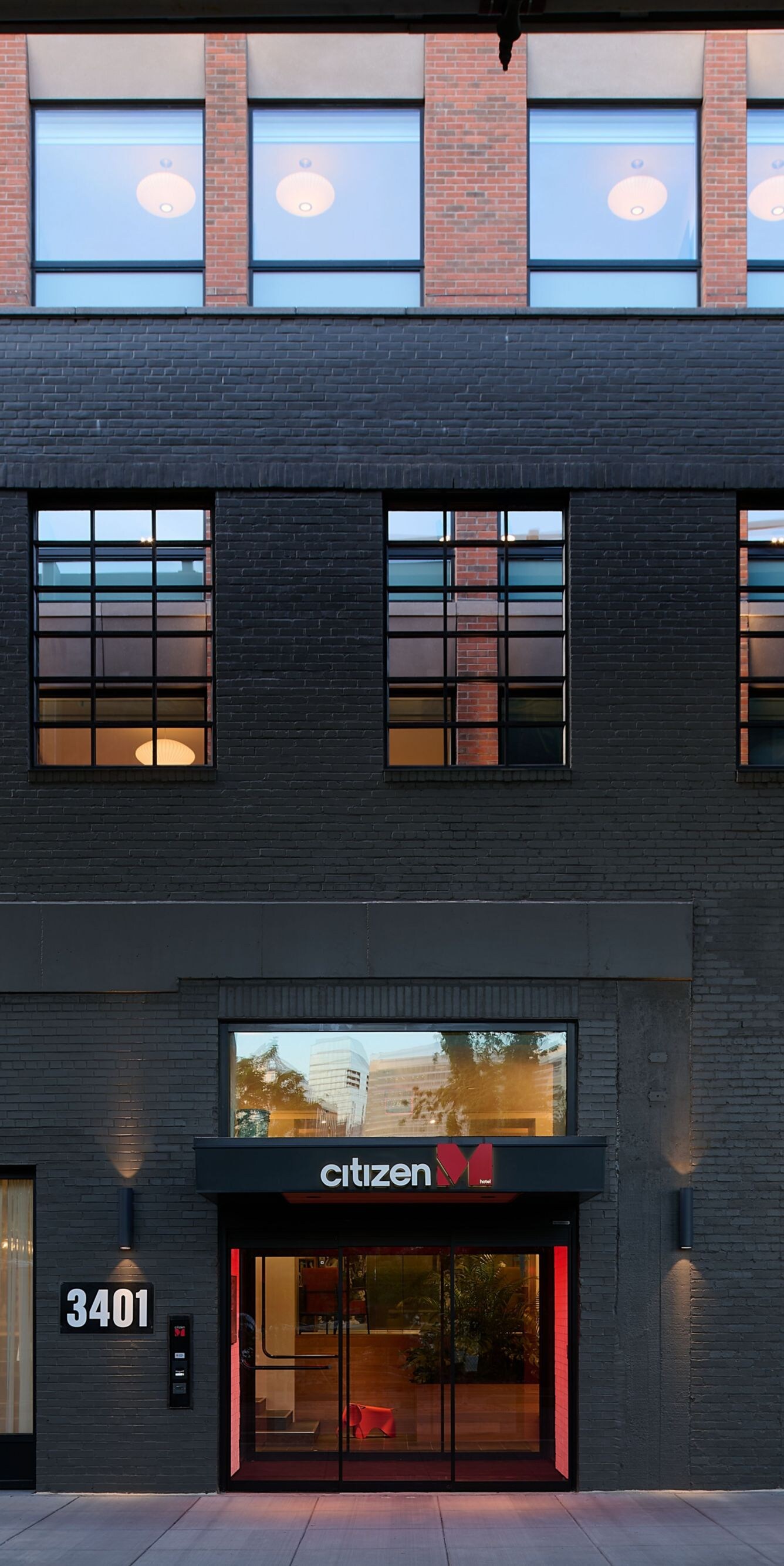 View of hotel entrance at dusk