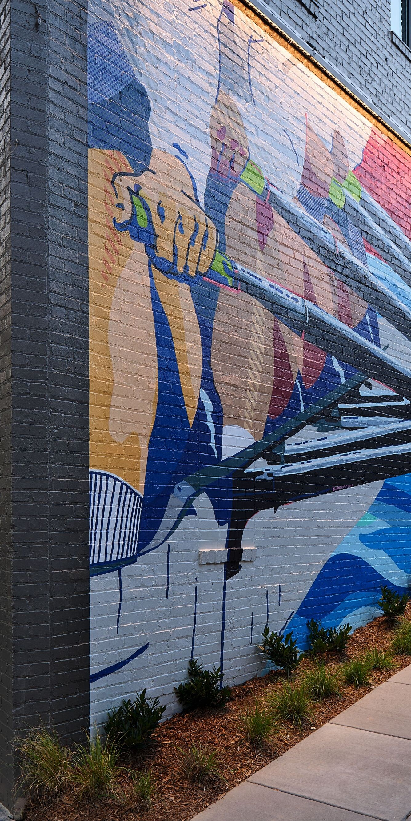 Corner of the hotel exterior with a mural