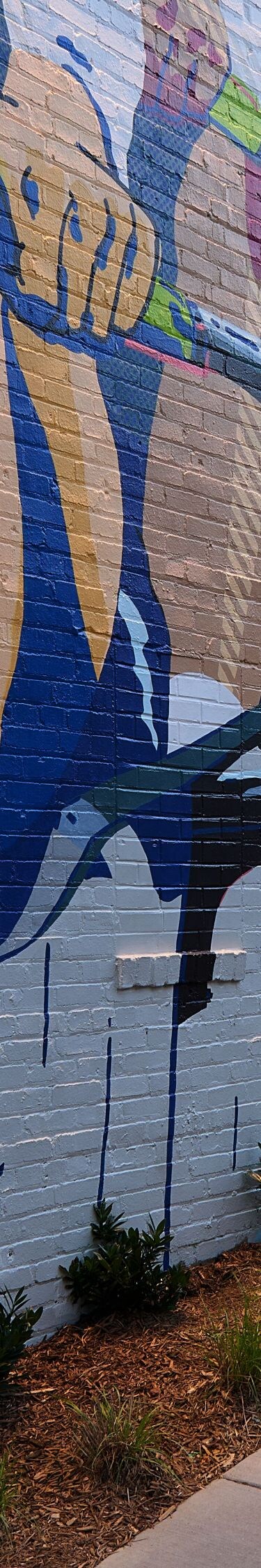Corner of the hotel exterior with a mural