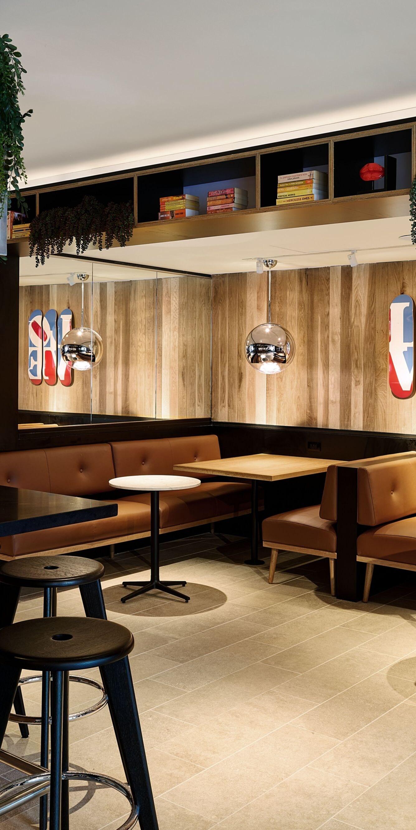 Dining with casual bar stools and booth tables
