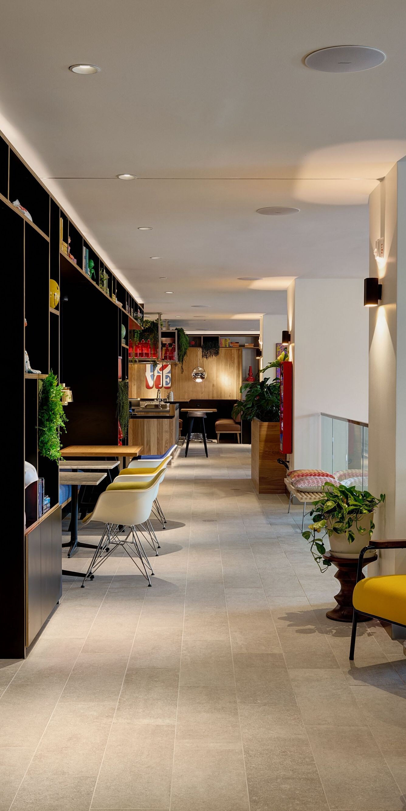Hotel living room with bookshelves of art