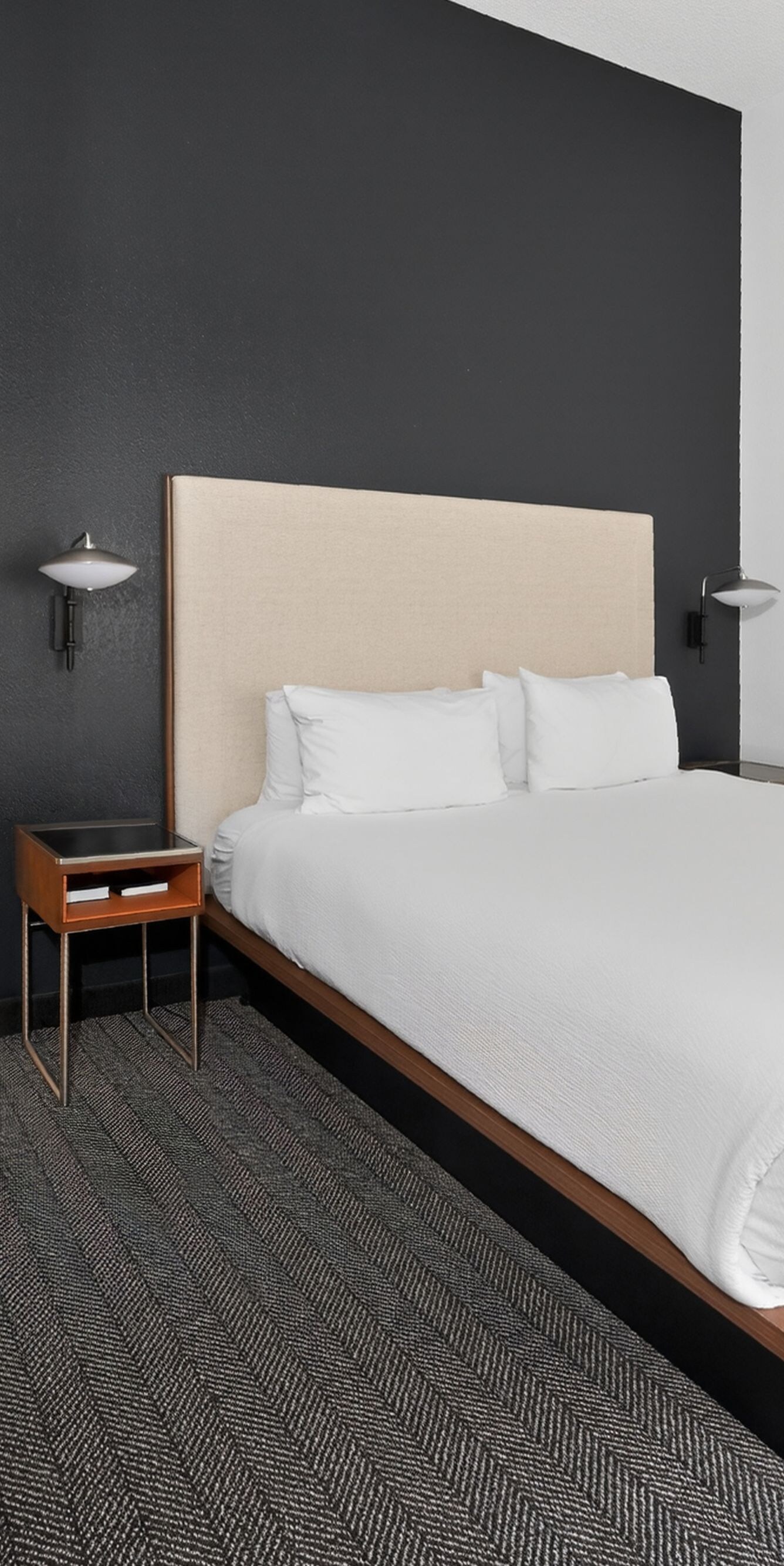 King Suite Bedroom has dresser, TV & more.