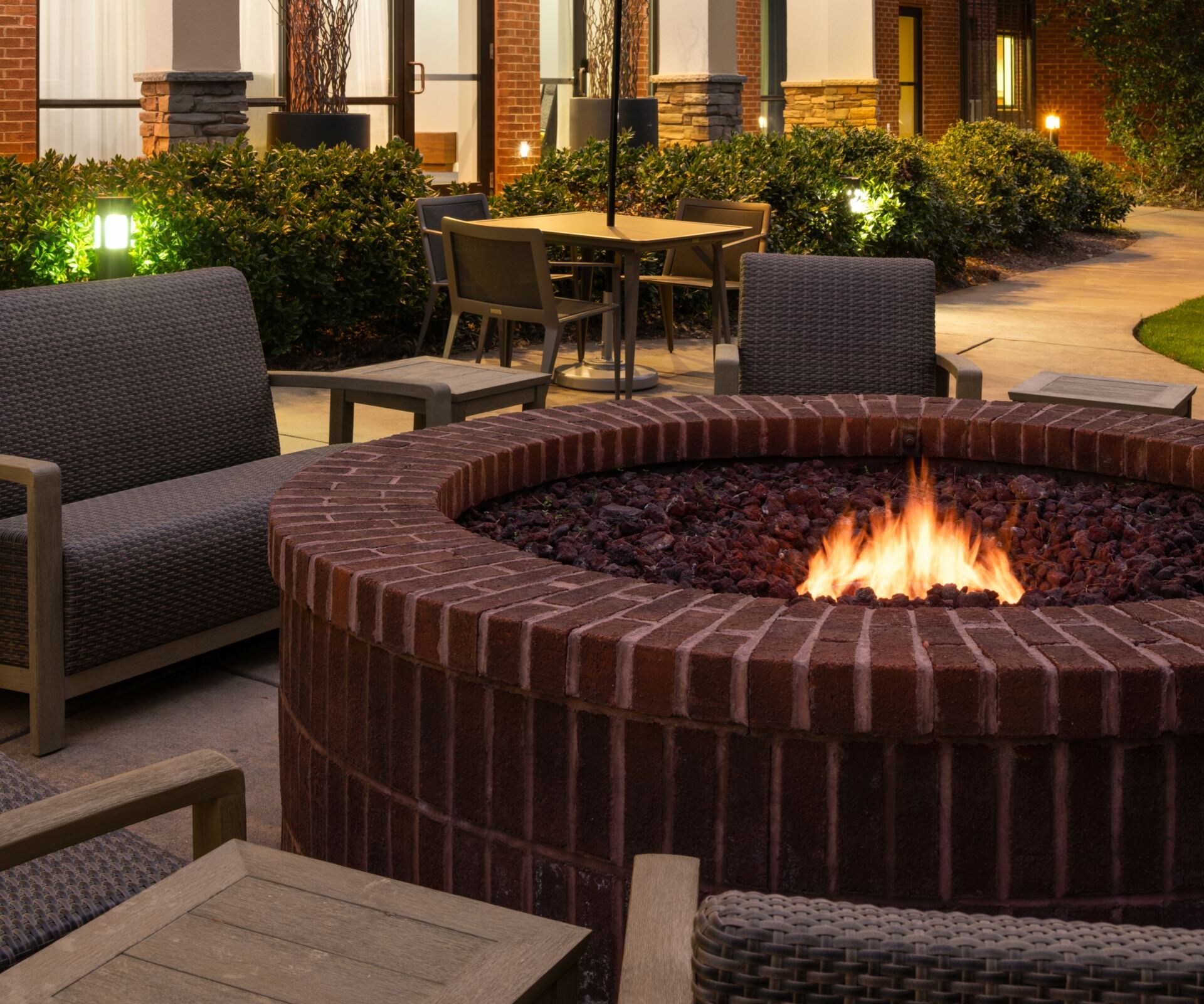 Exterior patio with firepit and seating