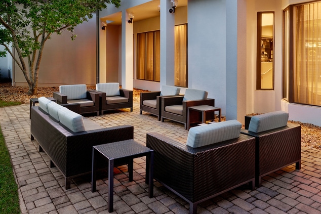 Outdoor seating with couch and chairs