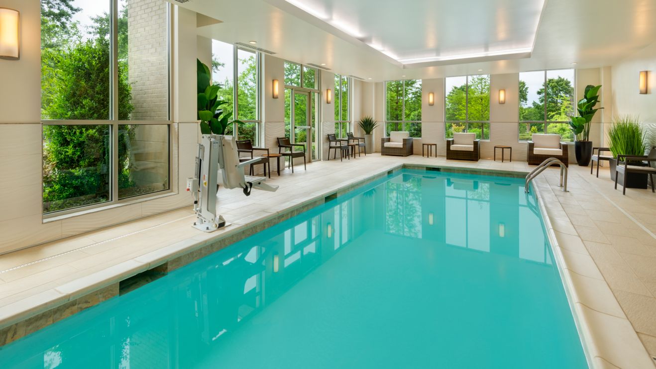indoor pool with chairs & ADA lift