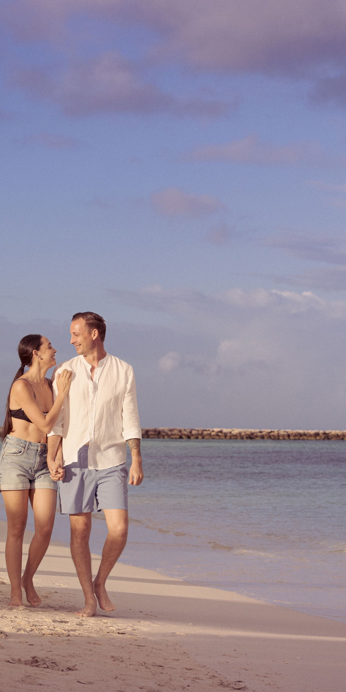 Couple walking on beach