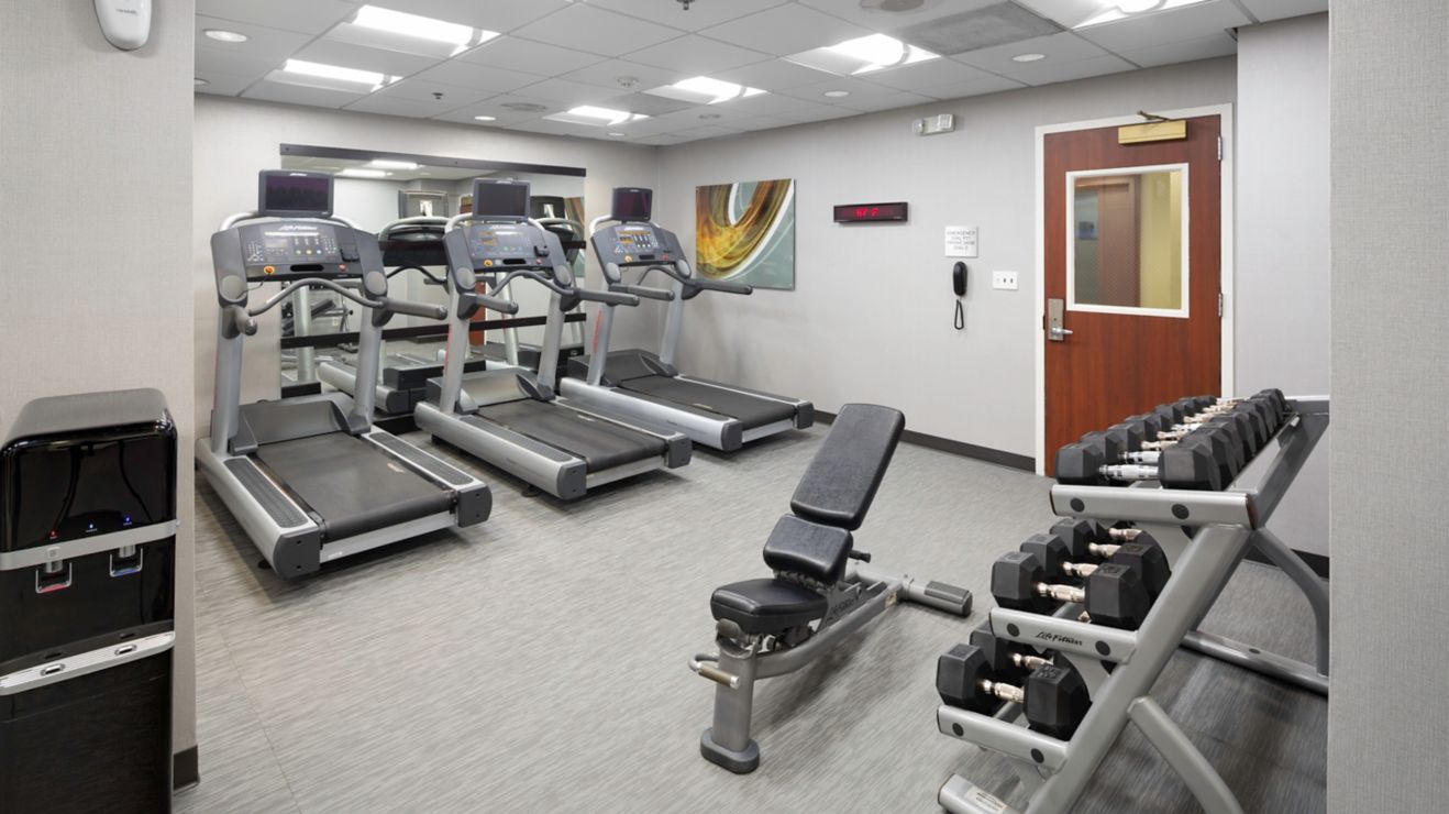 Fitness Center with cardio equipment and weights