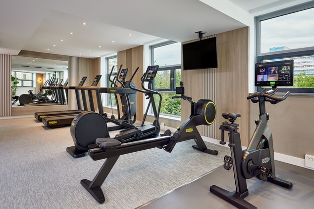 Fitness room with modern cardio machines 