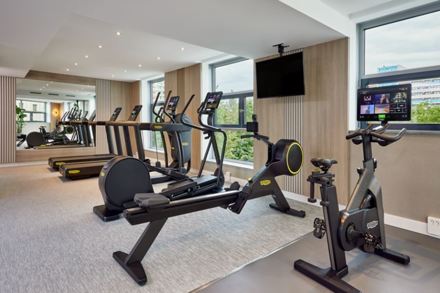 Fitness room with modern cardio machines 