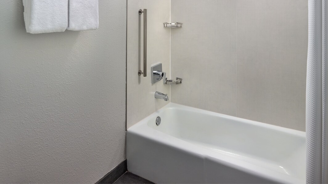 Bathtub and Shower combination with fresh towels