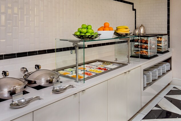 Breakfast buffet with hot options and fresh fruit