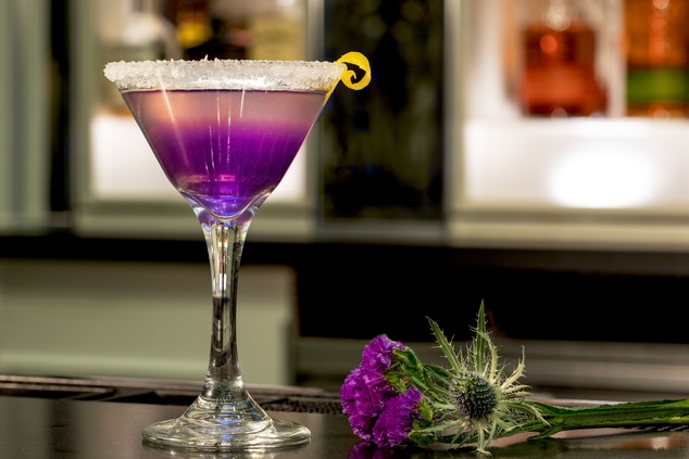 Purple Martini with florals on the bar