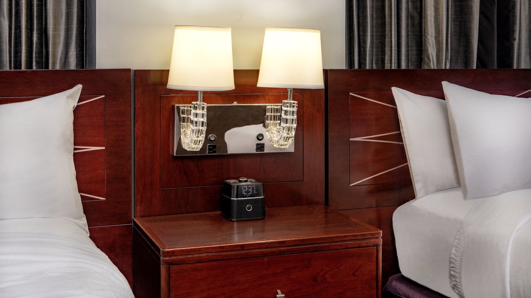 Nightstand with extra outlets by bed