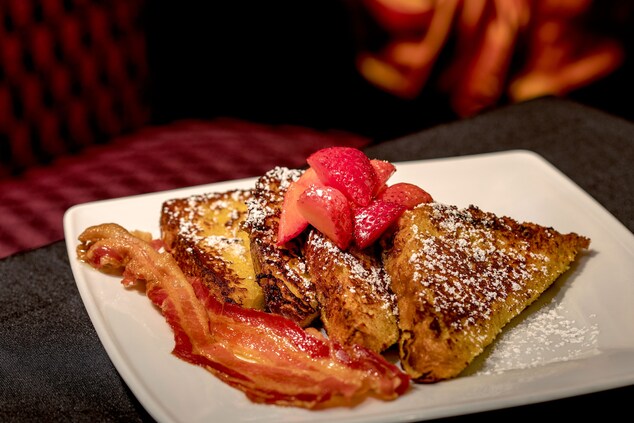 Plate of french toast, bacon, and strawberries
