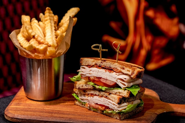 Turkey Club Sandwich with fries
