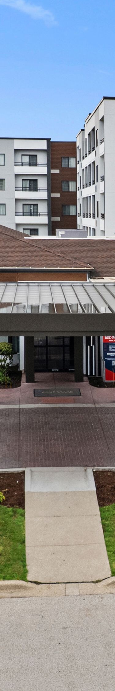 Daytime view of covered hotel entrance