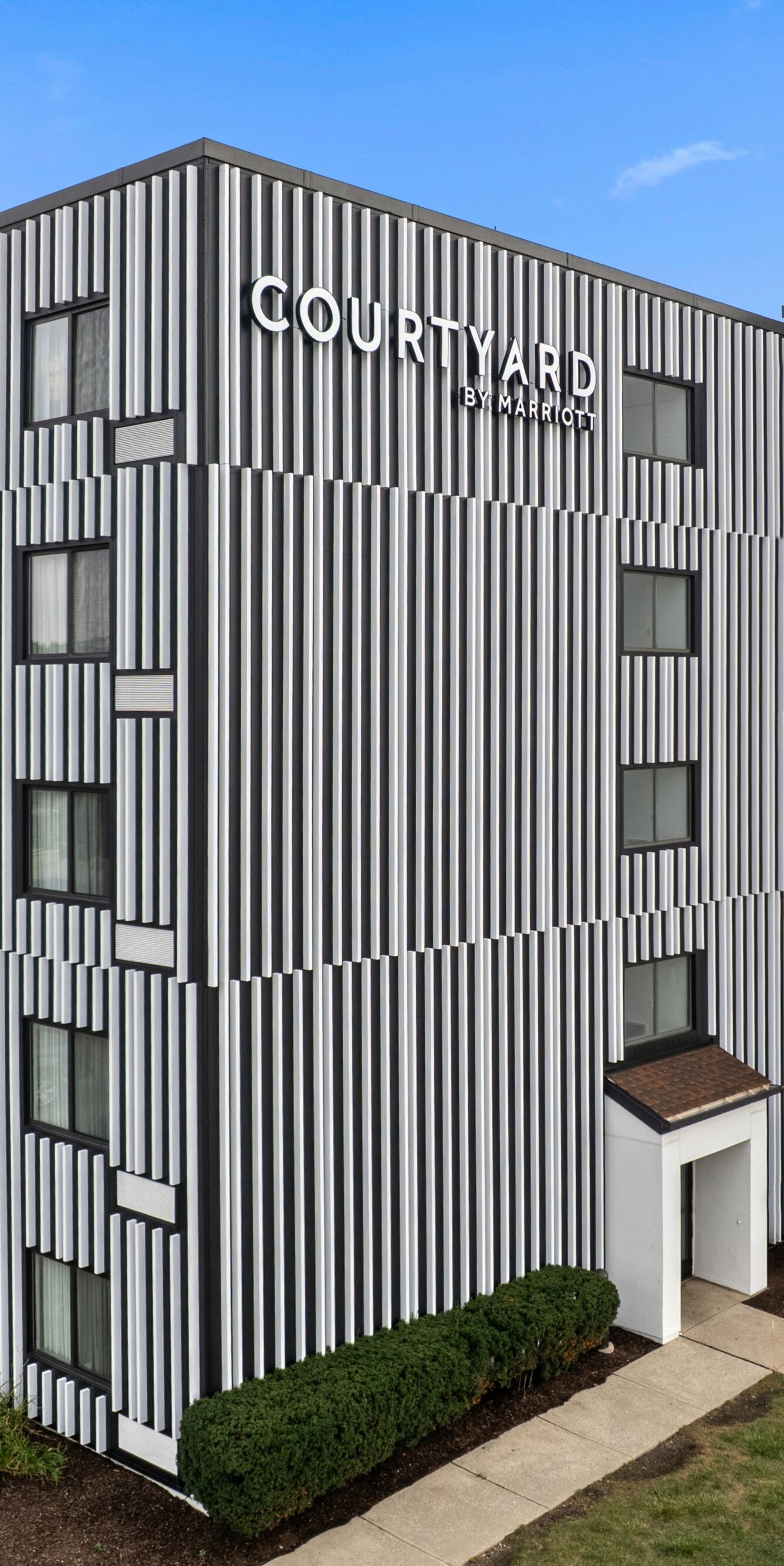 Multi-story hotel exterior with Courtyard signage