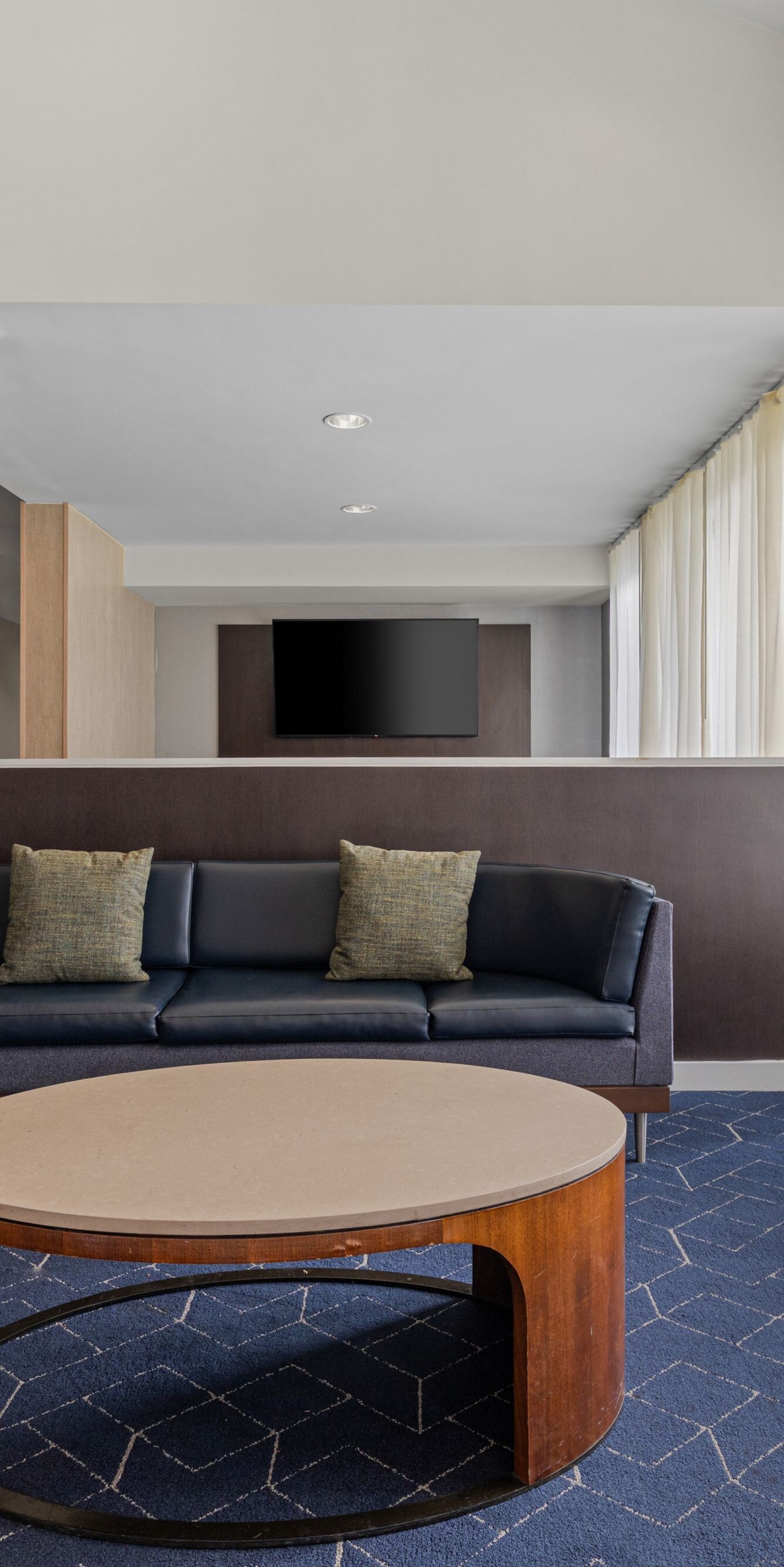 Lobby lounge with sectional sofa and chair