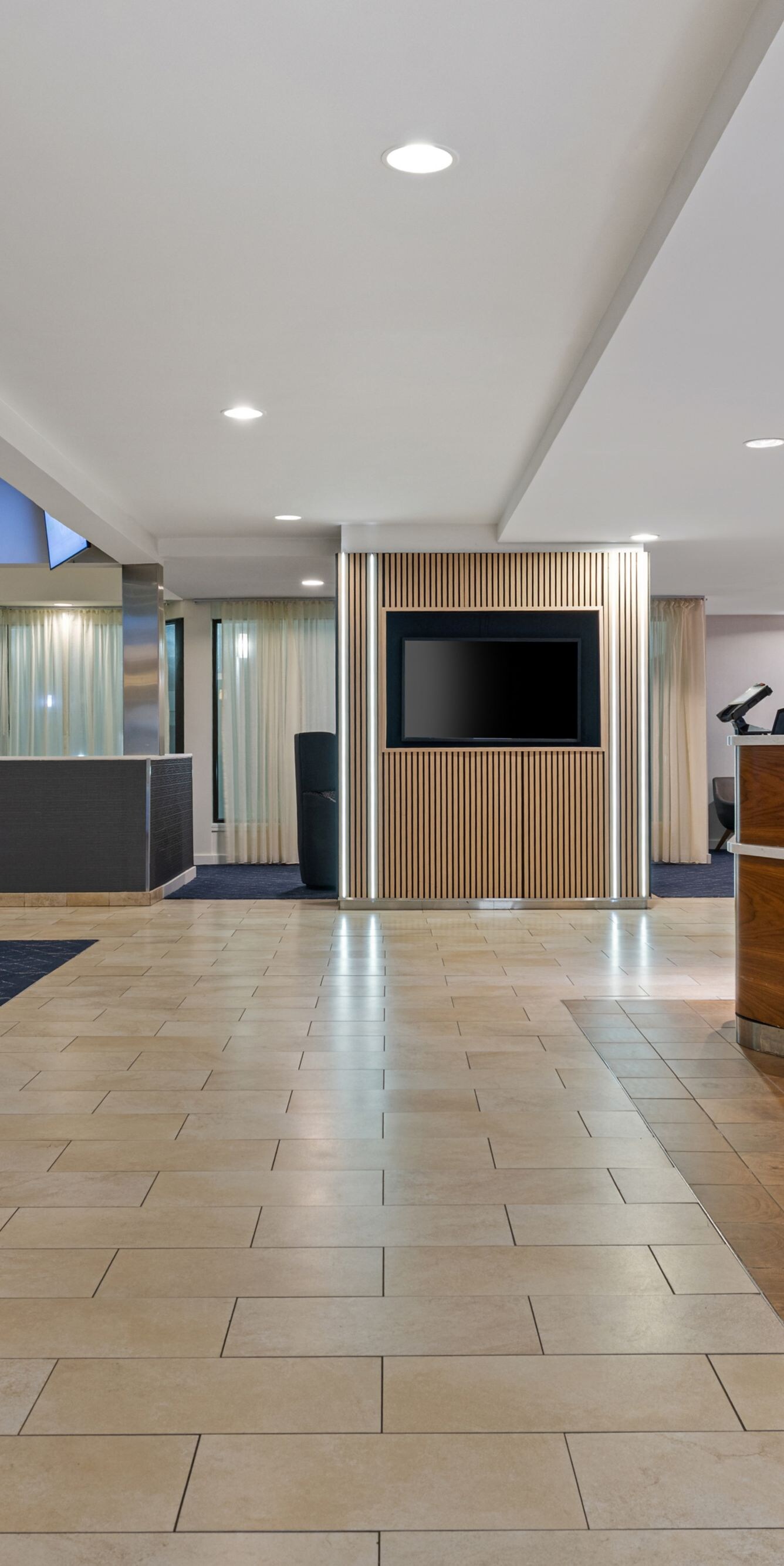 Lobby entrance with front desk and seating
