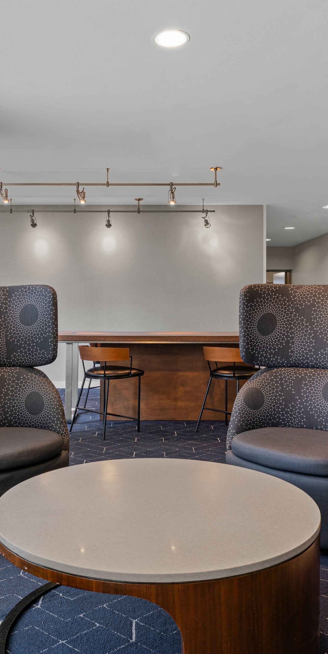 High-back chairs surrounding a round table
