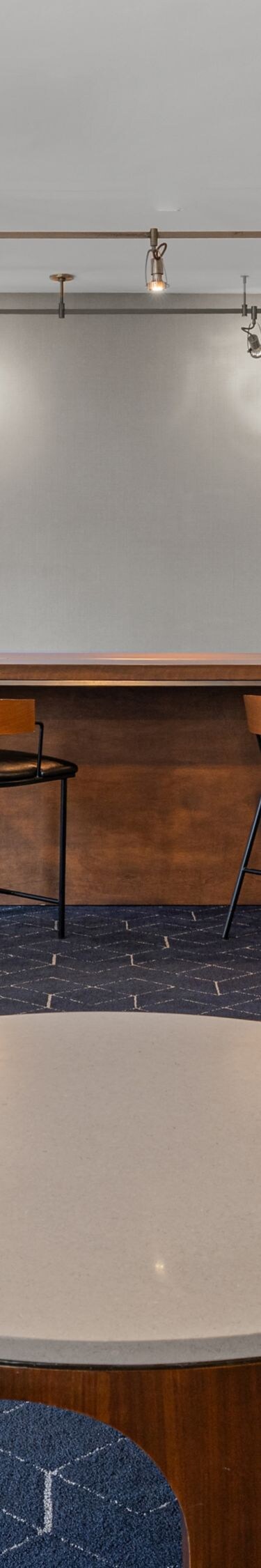 High-back chairs surrounding a round table