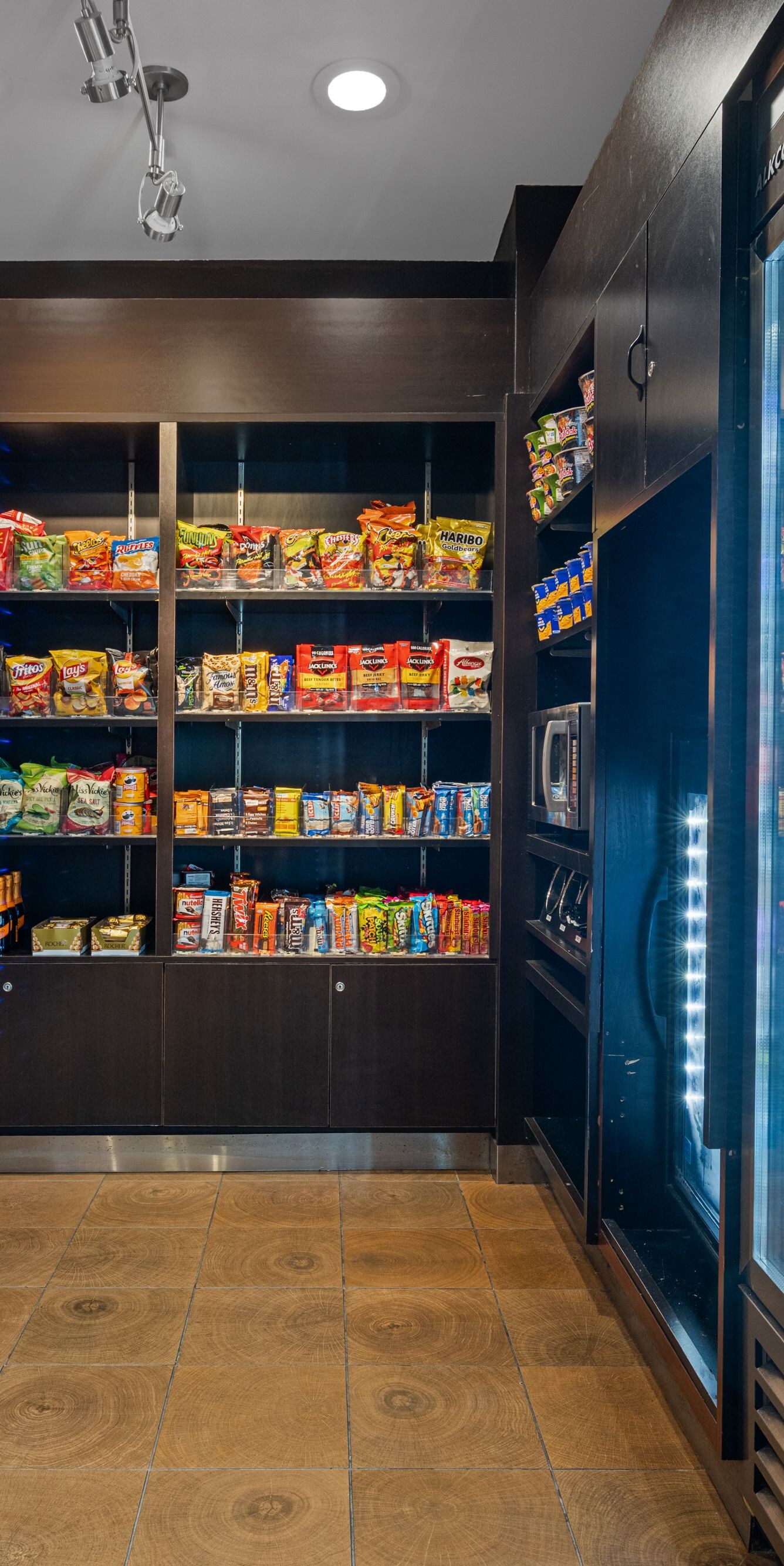Market shelves stocked with snacks and beverages