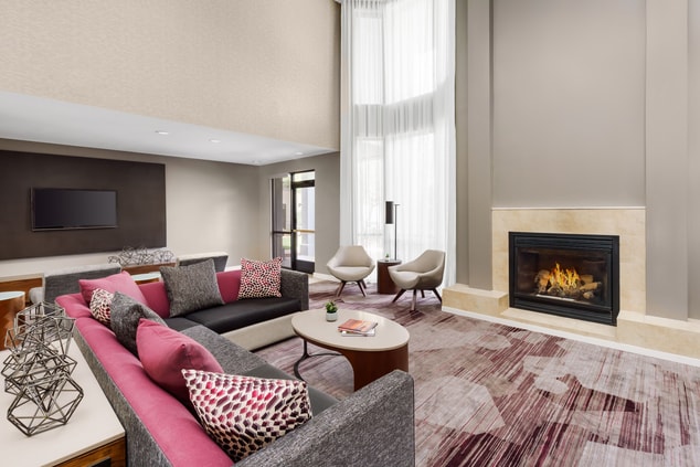 Large seating area with a fireplace and TV.