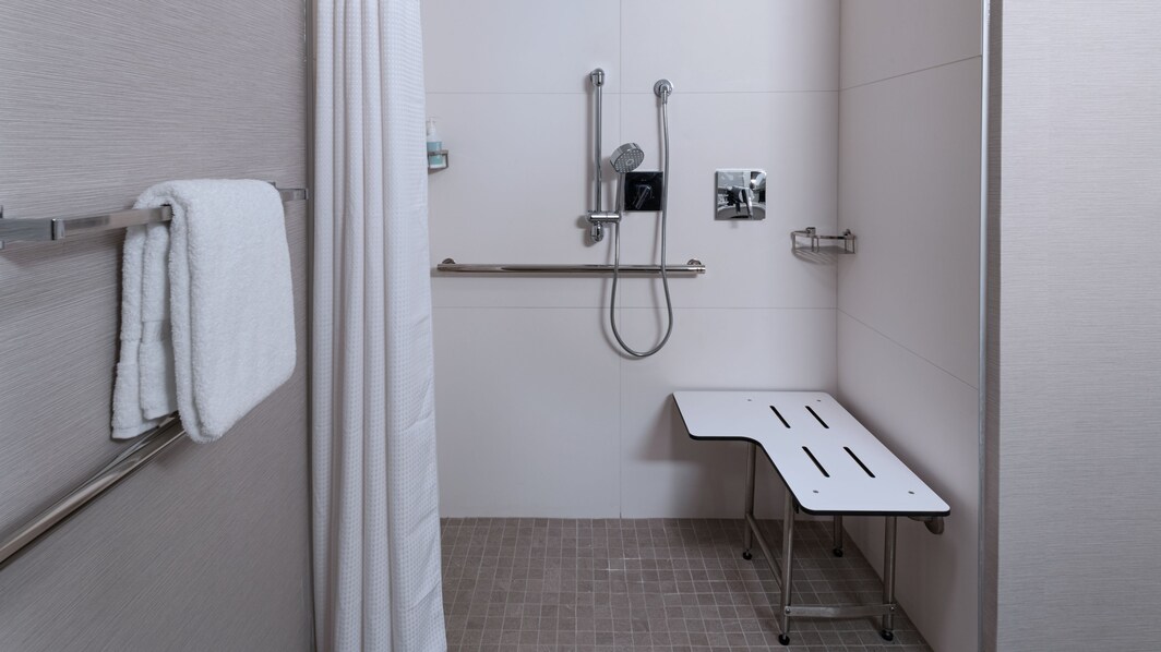 Accessible roll-in shower in select rooms