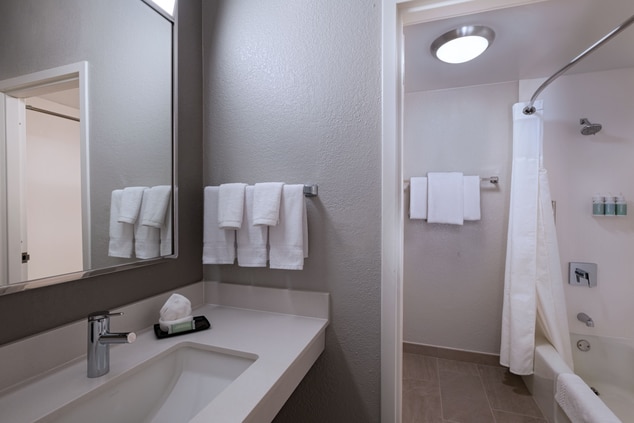 Standard bathroom featuring a bathtub and vanity