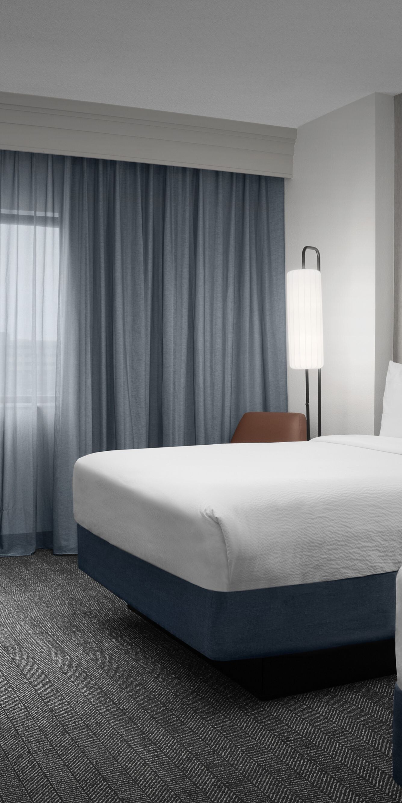 2 Double Beds in guest room with desk area