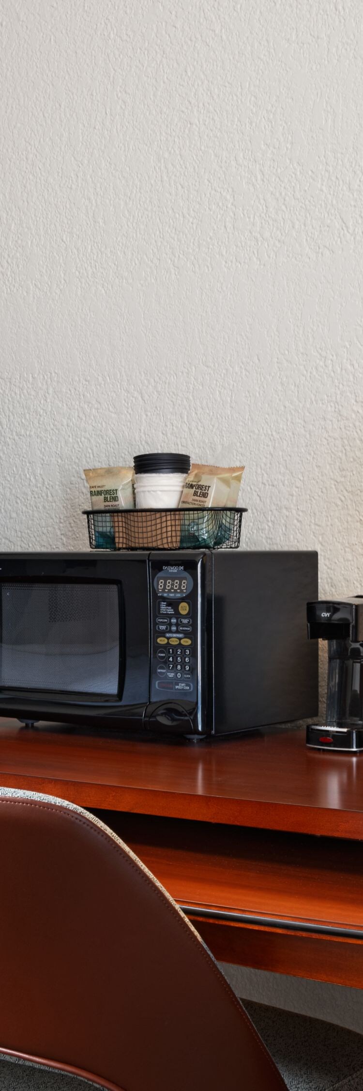 desk area, tv, chair, microwave, lamp, coffee