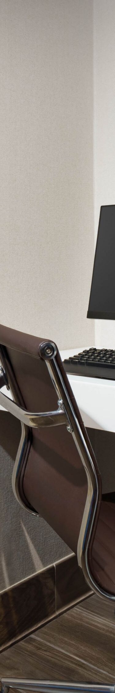 A computer workstation near a staircase.