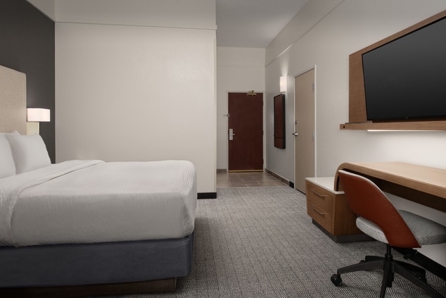 ADA accessible guest room with king bed and tv