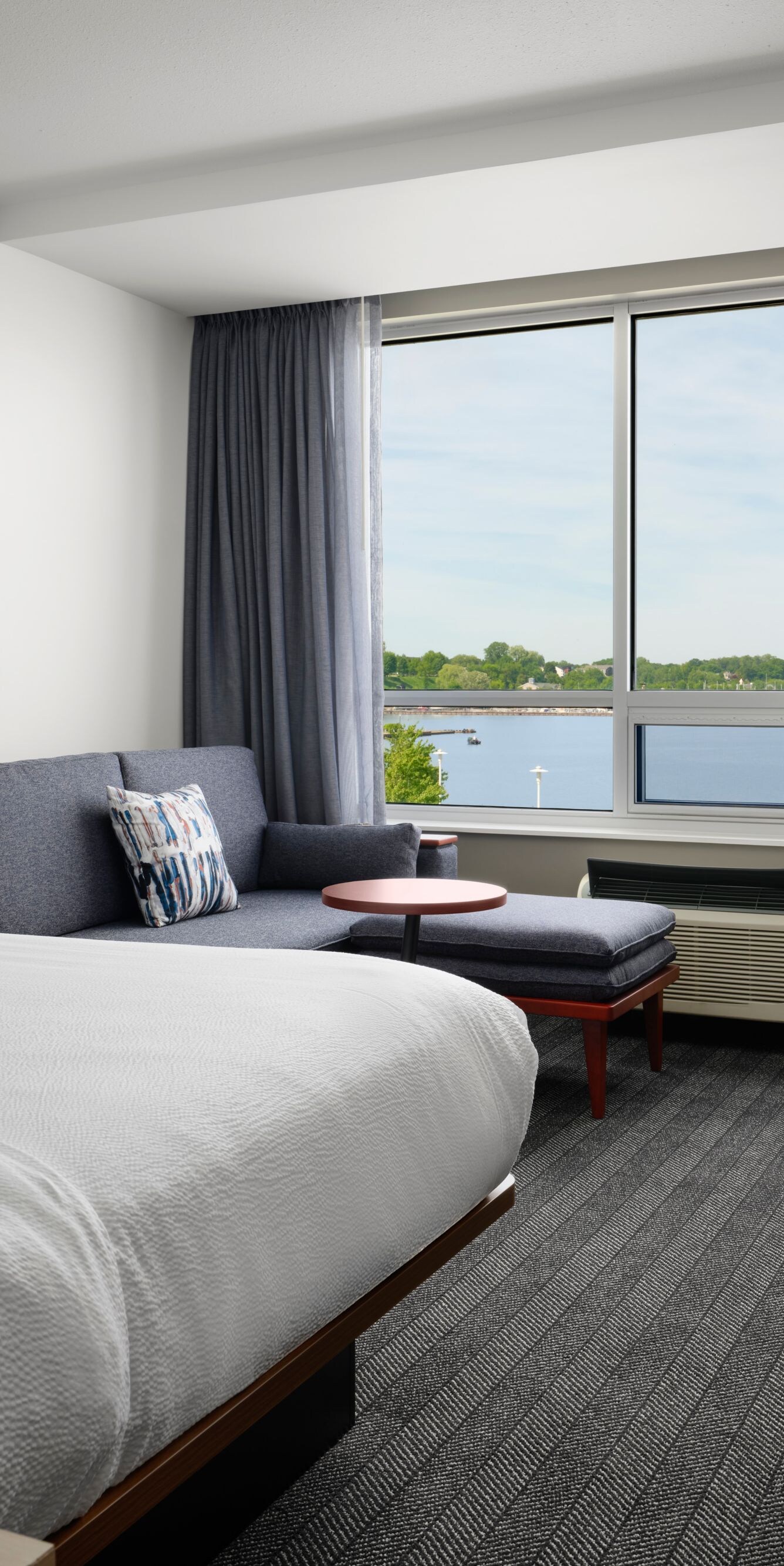 King room with sofa and water view