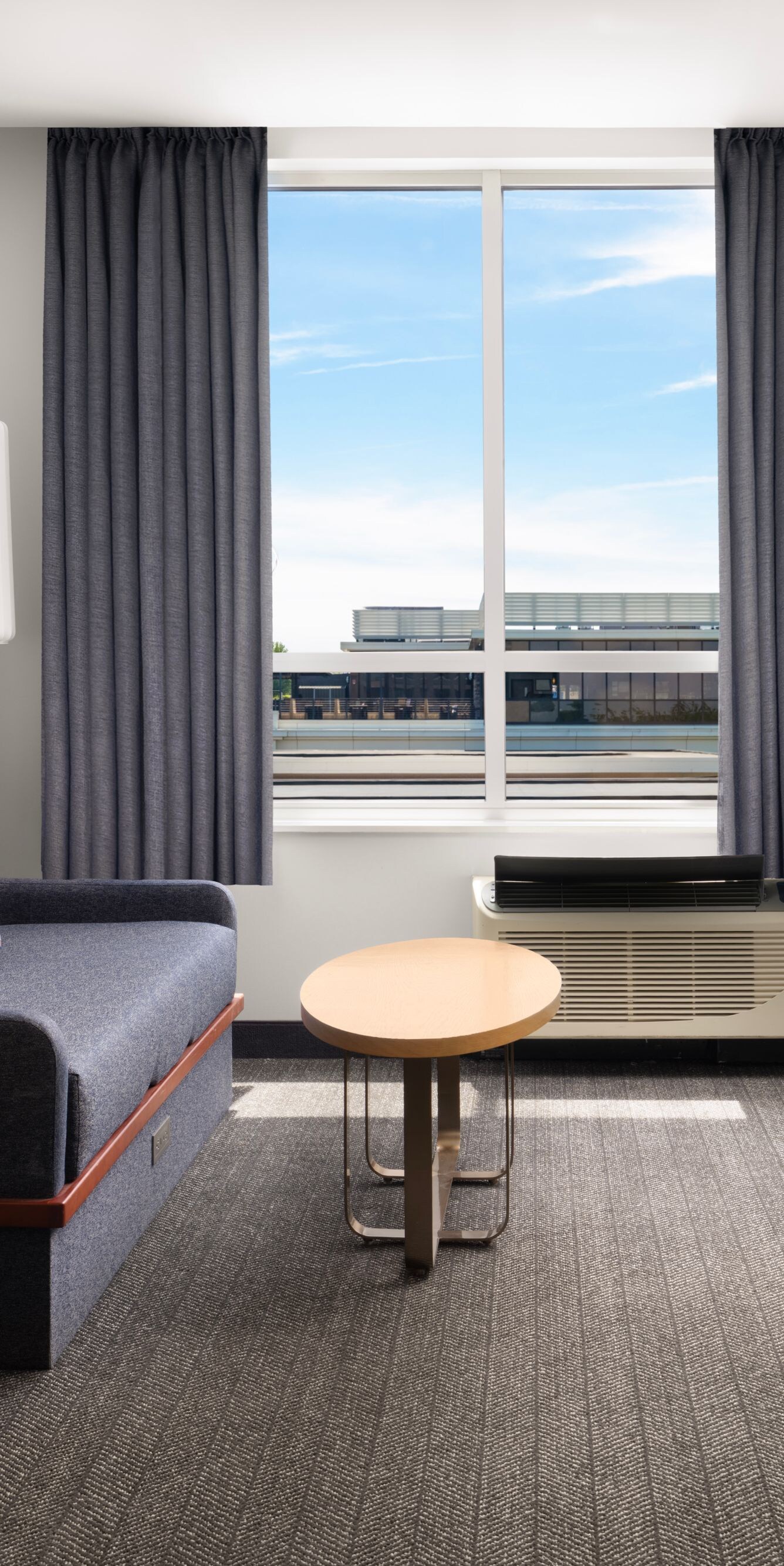 Suite living area with sofa, dining table, desk